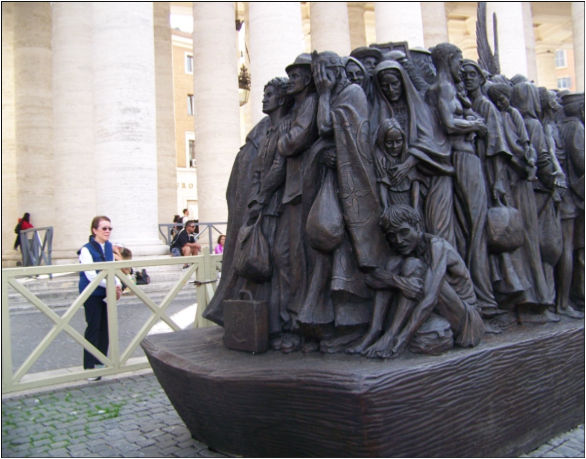 (Sr. Marge Perron, RJM at the Migrant Statue in Rome)